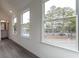 Hallway with hardwood floors and a bright window at 101 Pearl St, Woodstock, GA 30188