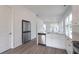 Well-appointed kitchen with stainless appliances, hardwood floors, and modern design at 101 Pearl St, Woodstock, GA 30188