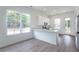 Modern kitchen with white cabinets, stainless steel appliances, and a breakfast bar at 101 Pearl St, Woodstock, GA 30188
