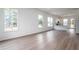 Bright, airy living room featuring hardwood floors and large windows for natural light at 101 Pearl St, Woodstock, GA 30188