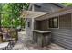 Back deck with a shaded seating area, BBQ station and access to the backyard at 1220 Wade Green Nw Cir, Acworth, GA 30102