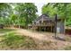 Exterior view of the home with a backyard, deck, privacy fence and basketball hoop at 1220 Wade Green Nw Cir, Acworth, GA 30102