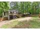 Expansive backyard featuring a wooden deck, spacious patio, and ample room for outdoor activities at 1220 Wade Green Nw Cir, Acworth, GA 30102