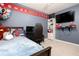 bedroom with bed, desk and TV, creating a comfortable place to play and relax at 1220 Wade Green Nw Cir, Acworth, GA 30102