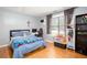 Comfortable bedroom with hardwood floors, a double bed and a window providing natural light at 1220 Wade Green Nw Cir, Acworth, GA 30102