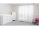 Cozy bedroom featuring carpet flooring, large curtains, dresser and a chair at 1220 Wade Green Nw Cir, Acworth, GA 30102