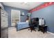 bedroom with a bed, desk with computer, and a personalized wall design, creating a fun space at 1220 Wade Green Nw Cir, Acworth, GA 30102