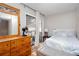Bright bedroom with a large window offering natural light, complemented by a dresser and a bed at 1220 Wade Green Nw Cir, Acworth, GA 30102