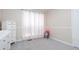 Bedroom featuring carpet flooring, large window, dresser and a chair at 1220 Wade Green Nw Cir, Acworth, GA 30102