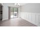 Elegant dining room featuring wainscoting and sliding glass doors leading to an outdoor deck at 1220 Wade Green Nw Cir, Acworth, GA 30102