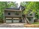 Charming two-story home featuring a two-car garage and a welcoming front porch with stairs at 1220 Wade Green Nw Cir, Acworth, GA 30102