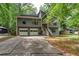 Charming two-story home with gray siding, a two-car garage, and a welcoming front porch at 1220 Wade Green Nw Cir, Acworth, GA 30102