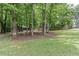 Well-maintained home surrounded by lush greenery and mature trees in a serene and private setting at 1220 Wade Green Nw Cir, Acworth, GA 30102