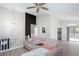 Bright living room boasting a decorative wall, wood flooring, a ceiling fan, and comfortable seating at 1220 Wade Green Nw Cir, Acworth, GA 30102