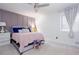 Comfortable main bedroom featuring a ceiling fan, decorative headboard and a large window at 1220 Wade Green Nw Cir, Acworth, GA 30102