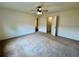 Spacious bedroom features a ceiling fan and ample closet space for comfortable living at 1606 Larkspur Trl, Conyers, GA 30012