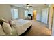 Bedroom includes natural light, a ceiling fan, closet, and comfortable carpet at 1606 Larkspur Trl, Conyers, GA 30012