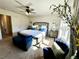 Inviting bedroom with a plush bed, ceiling fan, and a sun-filled window, creating a cozy space at 1606 Larkspur Trl, Conyers, GA 30012