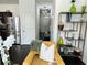 Stylish living room with stainless steel refrigerator, modern shelving, and decorative plants at 1606 Larkspur Trl, Conyers, GA 30012