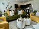 Beautifully staged living room with modern décor, stylish furniture, and seamless flow into the kitchen at 1606 Larkspur Trl, Conyers, GA 30012