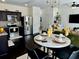 Open-concept living and kitchen area with stylish decor, modern appliances, and hardwood floors at 1606 Larkspur Trl, Conyers, GA 30012