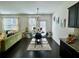 Open-concept kitchen and living area with modern decor, stylish furniture, and plenty of natural light at 1606 Larkspur Trl, Conyers, GA 30012