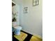 Toilet features neutral wall color and accent decorations at 1606 Larkspur Trl, Conyers, GA 30012