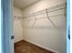 This walk-in closet offers ample storage space with wire racks for organized living at 1606 Larkspur Trl, Conyers, GA 30012