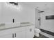 Bathroom with white vanity, vessel sink, and frameless glass shower with black hardware at 5200 Beechwood Forest Ct, Lithonia, GA 30038