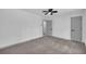 Bedroom with neutral carpet, ceiling fan, and modern gray doors at 5200 Beechwood Forest Ct, Lithonia, GA 30038