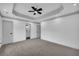 Bedroom featuring gray carpet, gray trim, recessed lighting, and 3 doors at 5200 Beechwood Forest Ct, Lithonia, GA 30038