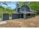 This home has a new paint job, a chimney, and a covered porch that runs nearly the length of the house at 5200 Beechwood Forest Ct, Lithonia, GA 30038