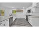 Kitchen features new stainless dishwasher, sink, and stone countertops at 5200 Beechwood Forest Ct, Lithonia, GA 30038