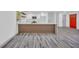 Modern kitchen island with white quartz countertop and wood accent, adding style to the open living space at 5200 Beechwood Forest Ct, Lithonia, GA 30038