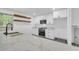 Bright kitchen features stone countertops, stainless appliances, and wood floating shelves at 5200 Beechwood Forest Ct, Lithonia, GA 30038
