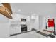 Modern white kitchen boasts stainless steel appliances and bright red door at 5200 Beechwood Forest Ct, Lithonia, GA 30038