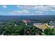 Overhead view of the property nestled among lush trees, offering a glimpse of the surrounding neighborhood and landscape at 54 Mildred Ct, Dallas, GA 30157
