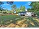 Wide backyard showing home exterior, newly built wooden fence, and a large grassy area perfect for Gathering activities at 54 Mildred Ct, Dallas, GA 30157