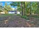Expansive backyard features a mix of grassy areas and natural surroundings, providing a private outdoor space at 54 Mildred Ct, Dallas, GA 30157