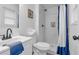 Compact bathroom features a new-looking vanity, toilet, and shower with stylish blue shower curtain at 54 Mildred Ct, Dallas, GA 30157