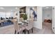 Bright dining area next to the living room showcases natural light and modern decor at 54 Mildred Ct, Dallas, GA 30157