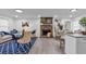 Bright living room boasting a stone fireplace, modern decor, and an adjacent dining area at 54 Mildred Ct, Dallas, GA 30157