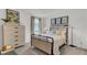 Comfortable bedroom featuring a metal bed frame, a large dresser, and bright, airy decor at 405 Newland Way, Acworth, GA 30102