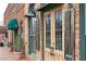 A rustic building exterior with wooden doors and green awnings providing unique character at 405 Newland Way, Acworth, GA 30102