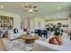 Open concept living room with modern decor flowing seamlessly into the kitchen and dining area at 405 Newland Way, Acworth, GA 30102