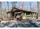 The Red Top Mountain visitor center with a flag sits amongst the trees at 405 Newland Way, Acworth, GA 30102