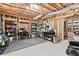 Unfinished basement featuring wood framing and ceiling and a workbench with tools at 6069 Queens River Dr, Mableton, GA 30126