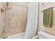 Tiled bathroom with a shower and tub combination at 6069 Queens River Dr, Mableton, GA 30126
