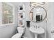 Bathroom featuring modern fixtures, vanity mirror, and great lighting at 6069 Queens River Dr, Mableton, GA 30126