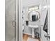 Bathroom featuring tiled shower and pedestal sink at 6069 Queens River Dr, Mableton, GA 30126